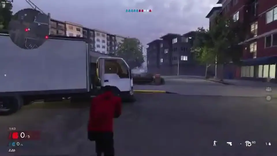 Hood Warfare 2 street with a box truck, apartment blocks, and the match HUD